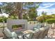 Stylish outdoor patio area with a modern fireplace, comfortable seating, and inviting ambiance at 3308 N 51St St, Phoenix, AZ 85018