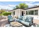 Inviting outdoor patio featuring comfortable seating, string lights, and well-manicured landscaping at 3308 N 51St St, Phoenix, AZ 85018