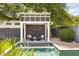 Relaxing poolside cabana with stylish seating and a tranquil backyard setting at 3308 N 51St St, Phoenix, AZ 85018