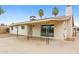 A covered patio features decorative support columns and a concrete surface in the backyard at 3337 W Yucca St, Phoenix, AZ 85029
