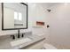 This modern bathroom features a step-in shower, granite countertops, and a modern sink at 3337 W Yucca St, Phoenix, AZ 85029