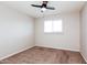 This bedroom features neutral paint, new carpet, and a ceiling fan for added comfort at 3337 W Yucca St, Phoenix, AZ 85029