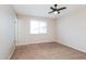 This bedroom features neutral paint, new carpet, and a ceiling fan for added comfort at 3337 W Yucca St, Phoenix, AZ 85029