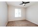This bedroom features neutral paint, new carpet, and a ceiling fan for added comfort at 3337 W Yucca St, Phoenix, AZ 85029