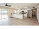 Open-concept kitchen with island seating, stainless steel appliances, and patio access at 3337 W Yucca St, Phoenix, AZ 85029
