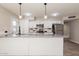 Well-lit kitchen boasting sleek countertops, stainless steel appliances, and ample cabinet space at 3337 W Yucca St, Phoenix, AZ 85029