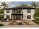 Relaxing backyard with patio, fire pit, outdoor dining, and lush tropical landscaping at 3423 E Campbell Ave, Phoenix, AZ 85018
