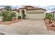 Charming single-story home featuring a well-manicured yard, neutral paint, tile roof, and a two-car garage at 3631 E Long Lake Rd, Phoenix, AZ 85048
