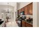 Well-appointed kitchen featuring granite countertops, wood cabinets, and stainless steel appliances and stylish tile flooring at 3631 E Long Lake Rd, Phoenix, AZ 85048