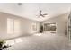 Bright and airy living room with neutral carpet, vaulted ceilings, and sliding glass doors to the backyard at 3631 E Long Lake Rd, Phoenix, AZ 85048