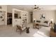 Open concept living room features a built-in shelving unit and views of the kitchen at 3631 E Long Lake Rd, Phoenix, AZ 85048