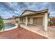 Covered patio beside pool, ideal for outdoor entertaining, and featuring stylish tile flooring and attractive landscaping at 3631 E Long Lake Rd, Phoenix, AZ 85048