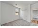 Neutral bedroom with carpet, window, and large closet at 37535 W Patterson St, Maricopa, AZ 85138