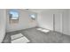 Comfortable bedroom with soft carpeting, windows, and neutral decor, ideal for creating a peaceful retreat at 37535 W Patterson St, Maricopa, AZ 85138