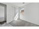 Bright bedroom featuring a window, closet with sliding doors and neutral colored carpeting at 37549 W San Clemente St, Maricopa, AZ 85138