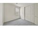 Neutral carpeted bedroom with neutral paint, a large window, and closet at 37549 W San Clemente St, Maricopa, AZ 85138