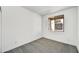 This bedroom offers neutral carpet, a window for natural light and a spacious closet at 37551 W Patterson St, Maricopa, AZ 85138