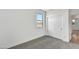 Bedroom with neutral carpet, closet with sliding doors and a window for natural light at 37551 W Patterson St, Maricopa, AZ 85138