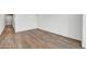 Spacious living room features wood floors and natural lighting at 37551 W Patterson St, Maricopa, AZ 85138