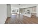 Open-concept living space with wood floors, natural light, and modern finishes at 37551 W Patterson St, Maricopa, AZ 85138