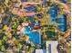 An aerial view showcases the community's pool, tennis courts, and recreational areas amidst lush landscaping at 3935 E Rough Rider Rd # 1016, Phoenix, AZ 85050