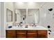 Bathroom with double sinks, large mirrors, and walk-in shower at 3935 E Rough Rider Rd # 1016, Phoenix, AZ 85050