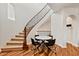 Entryway featuring hardwood floors, a staircase, and modern furniture at 3935 E Rough Rider Rd # 1016, Phoenix, AZ 85050
