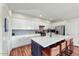 Bright kitchen features white cabinets, stainless appliances, and a large island with seating at 3935 E Rough Rider Rd # 1016, Phoenix, AZ 85050