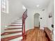 Beautiful staircase with wood banister and hardwood floors leading to the upper level at 3935 E Rough Rider Rd # 1016, Phoenix, AZ 85050