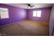 A spacious bedroom with large windows offers plenty of natural light and plush carpeting at 44944 W Miramar Rd, Maricopa, AZ 85139