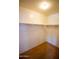 Walk-in closet with shelving and neutral carpeting at 44944 W Miramar Rd, Maricopa, AZ 85139