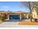 Charming single-story home with a two-car garage and a well-maintained front yard in a desirable community at 44944 W Miramar Rd, Maricopa, AZ 85139