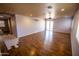 Spacious living room with hardwood flooring, neutral walls, and natural light, creating a warm and inviting atmosphere at 44944 W Miramar Rd, Maricopa, AZ 85139