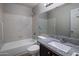 Bathroom features a bathtub, granite countertop vanity, and a large mirror at 4753 E Bighorn Ave, Phoenix, AZ 85044