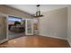 Bright dining room with hardwood floors and sliding glass doors to the outdoor kitchen at 4753 E Bighorn Ave, Phoenix, AZ 85044
