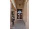 Inviting front entrance with stylish double doors featuring a decorative cactus design and upper window at 4753 E Bighorn Ave, Phoenix, AZ 85044