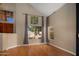 Living room features vaulted ceiling, hardwood floors, and a large window at 4753 E Bighorn Ave, Phoenix, AZ 85044