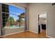Bright living room showcases a large window overlooking the pool, enhancing natural light at 4753 E Bighorn Ave, Phoenix, AZ 85044