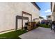 The backyard features artificial grass and a custom-built wooden bar, perfect for outdoor entertaining at 4901 S Turbine --, Mesa, AZ 85212