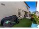 Backyard with artificial grass featuring a covered bike and other outdoor furnishings at 4901 S Turbine --, Mesa, AZ 85212