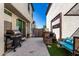 This backyard features a BBQ grill, a wooden bar, and artificial grass, perfect for outdoor gatherings at 4901 S Turbine --, Mesa, AZ 85212