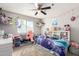 Bright bedroom with light gray walls, a ceiling fan and window with bright natural light at 4901 S Turbine --, Mesa, AZ 85212