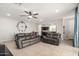 Comfortable living room showcasing neutral walls and tile flooring, open to the kitchen at 4901 S Turbine --, Mesa, AZ 85212