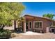 Cozy covered patio with comfortable seating and views of the landscaped yard at 4976 S Sugarberry Ln, Gilbert, AZ 85298