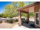 Spacious covered patio with seating, perfect for relaxing and enjoying the outdoors at 4976 S Sugarberry Ln, Gilbert, AZ 85298