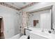 Clean bathroom with a tub and shower combination and ample counter space at 4976 S Sugarberry Ln, Gilbert, AZ 85298