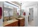 Well-appointed bathroom with dual vanities, granite counters, and a view of a separate shower at 4976 S Sugarberry Ln, Gilbert, AZ 85298