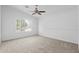 Bedroom features a ceiling fan and neutral carpet at 4976 S Sugarberry Ln, Gilbert, AZ 85298