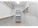 Walk-in closet with ample shelving and hanging space provides organization and storage at 4976 S Sugarberry Ln, Gilbert, AZ 85298