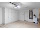 Organized garage space featuring built-in cabinets, water heater, and ample room at 4976 S Sugarberry Ln, Gilbert, AZ 85298